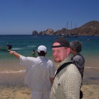 Working on the beach, Cabo San Lucas, Mexico, 2001AD. A place Irish folk just aren't meant to venture. Photo by Mr. E. while checking out my camera. I could tell you the names of the folk in the picture but then I'd have to kill you (or at least I'd be killed).